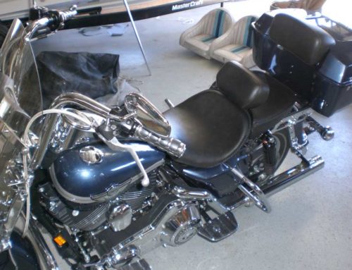 Blue and Silver Motorcycle with custom black seat